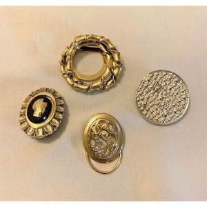 four vintage '70s gold scarf clips